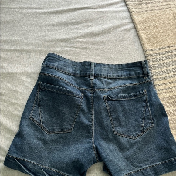 “D” jeans .  Blue denim  2 buttons. Waist 15” inseam  8. “ 2 pockets in back . - Picture 2 of 3